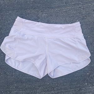Lavender colored athletic shorts- have small mesh pockets on waistband